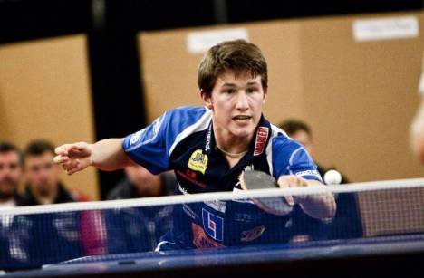 A young Kristian Karlsson practicing table tennis at home